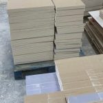 Plasterboard cut to size stacked in workshop, offsite cutting service Elsenham Essex