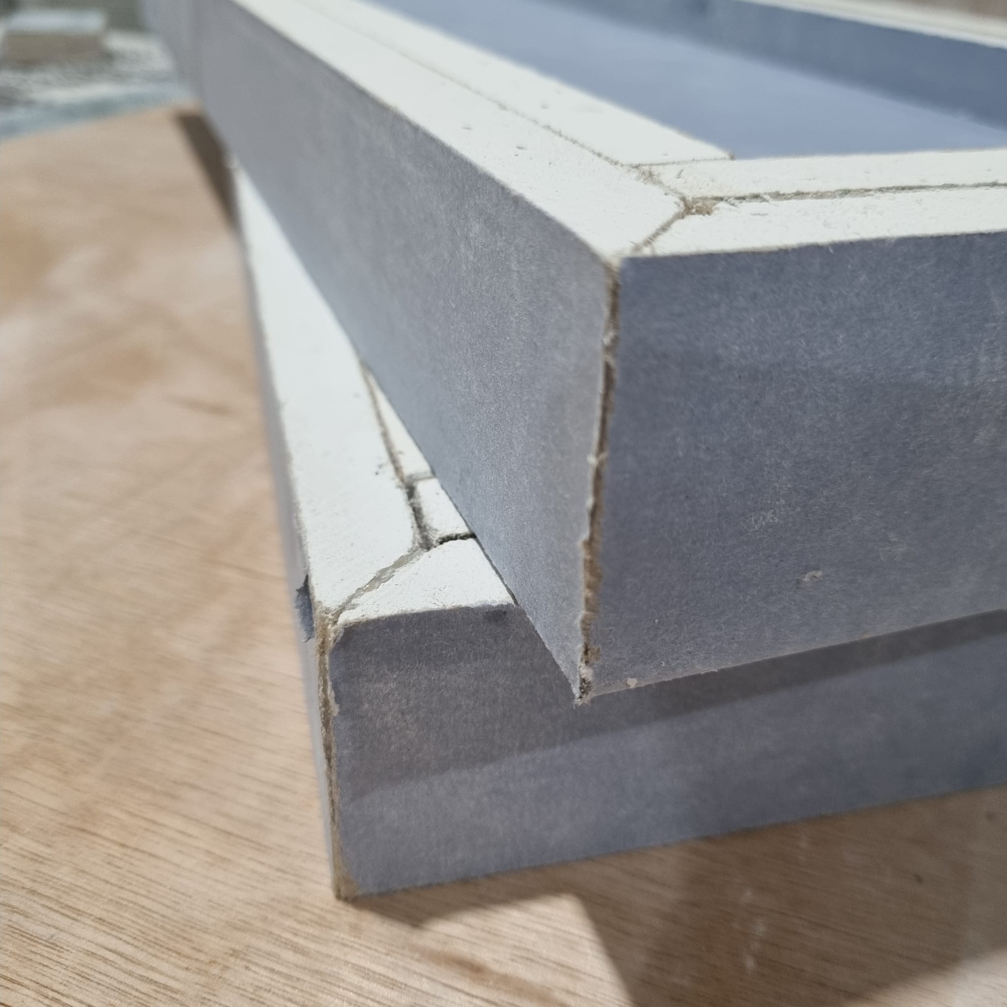 Plasterboard baffle box corner detail showing precision CNC cut offsite