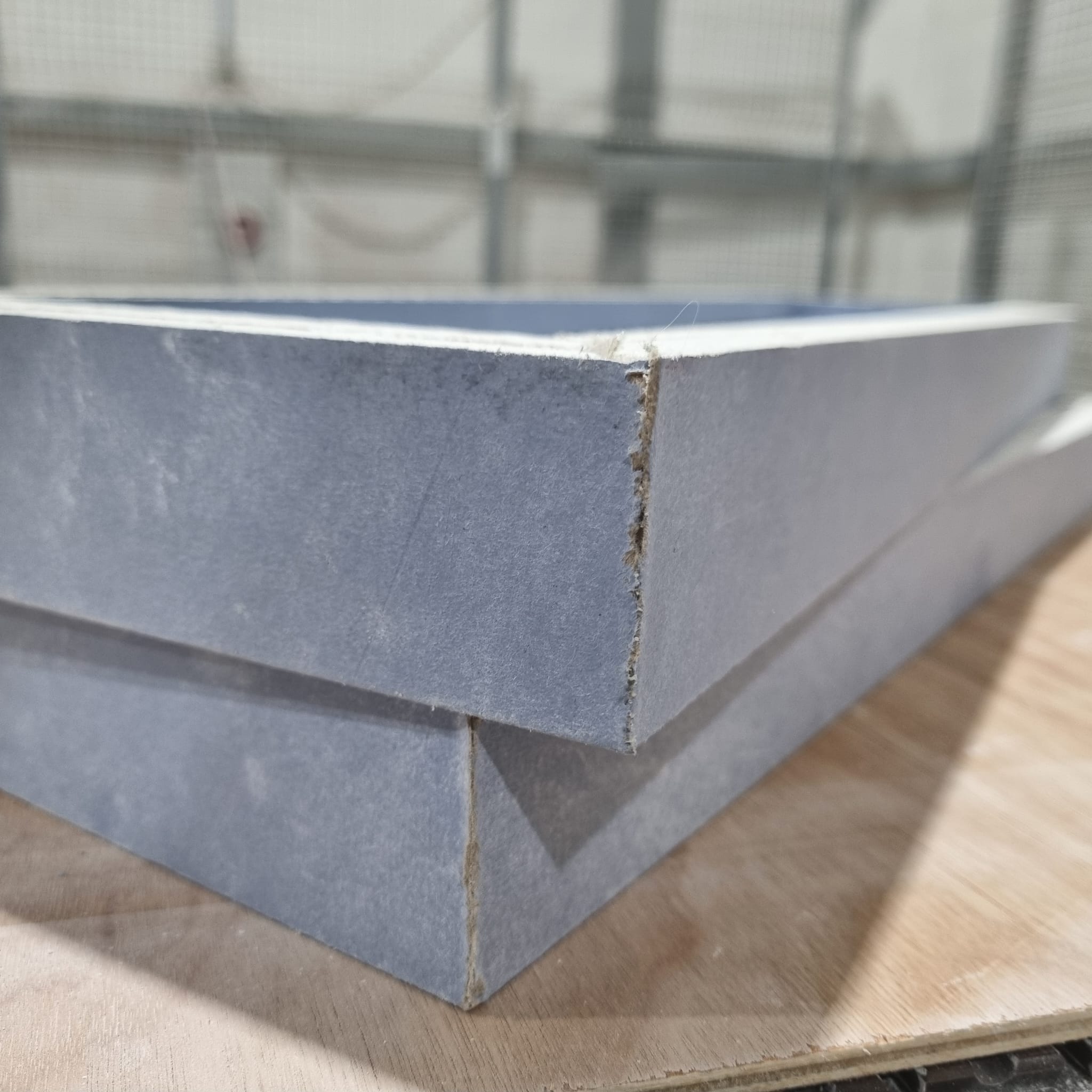 Pre-formed plasterboard baffle box showing CNC cut fold and clean edge