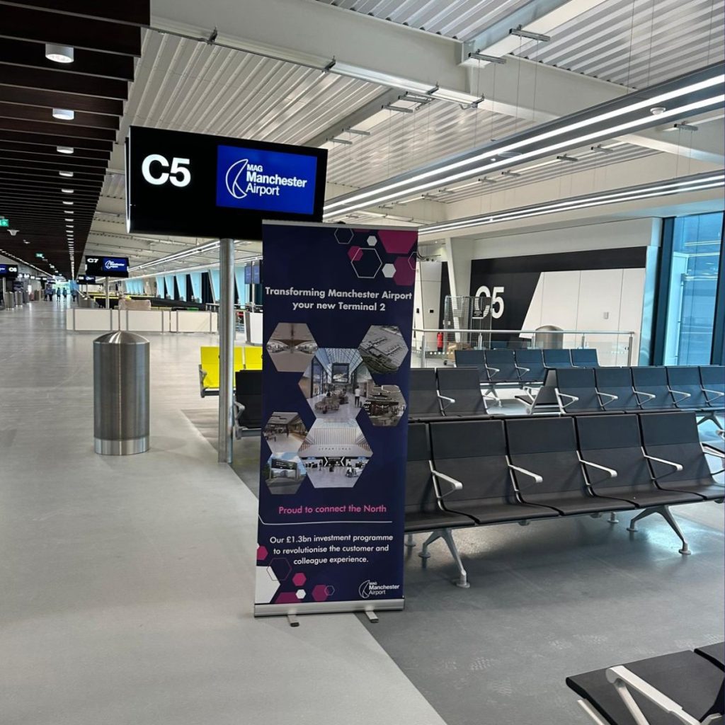 Completed ceiling at Manchester Airport Terminal 2 departure gate C5, with the finished plasterboard ceiling foils in place above the seating area.