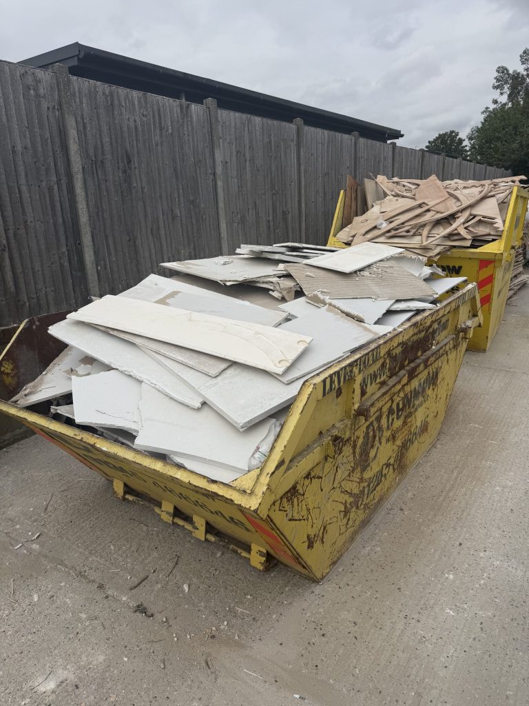 Plasterboard offcuts separated from timber waste in skips at Innovate at SA